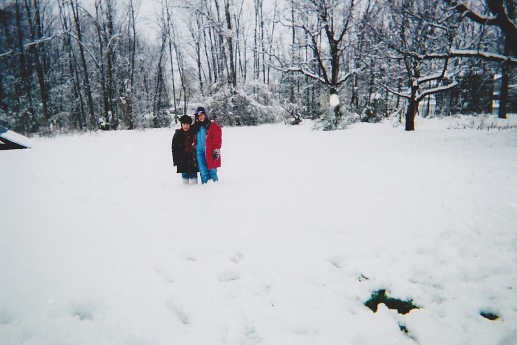 Kids Standing in Snow at Grandparent's House
